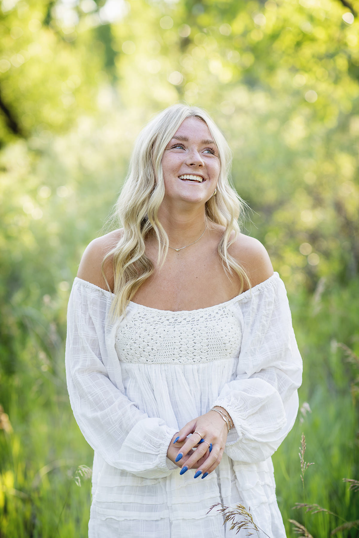 Highlands Ranch High School Senior Pictures Girl in Tall Grass Wearing White Dress
