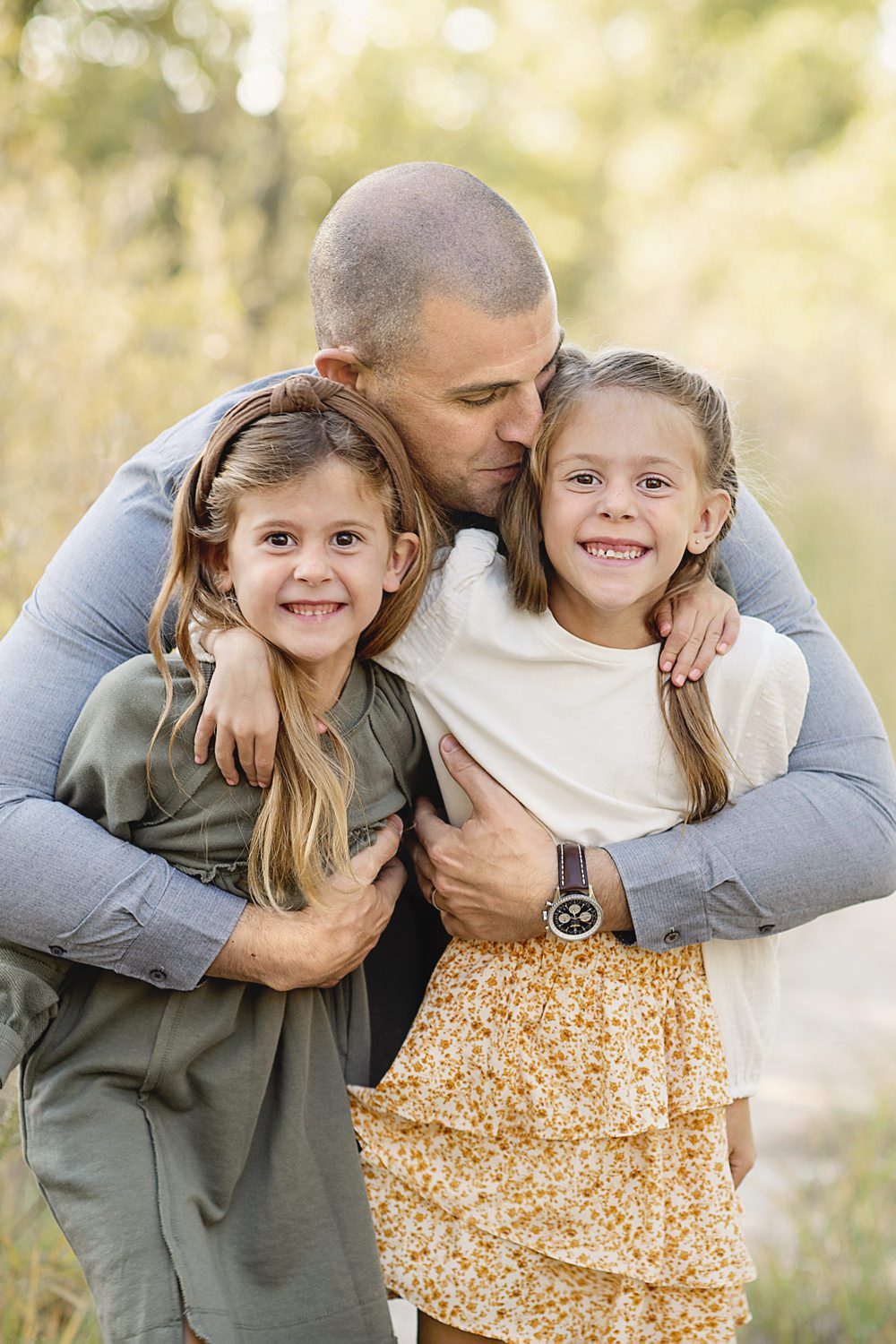 dad and his kids playing together picture