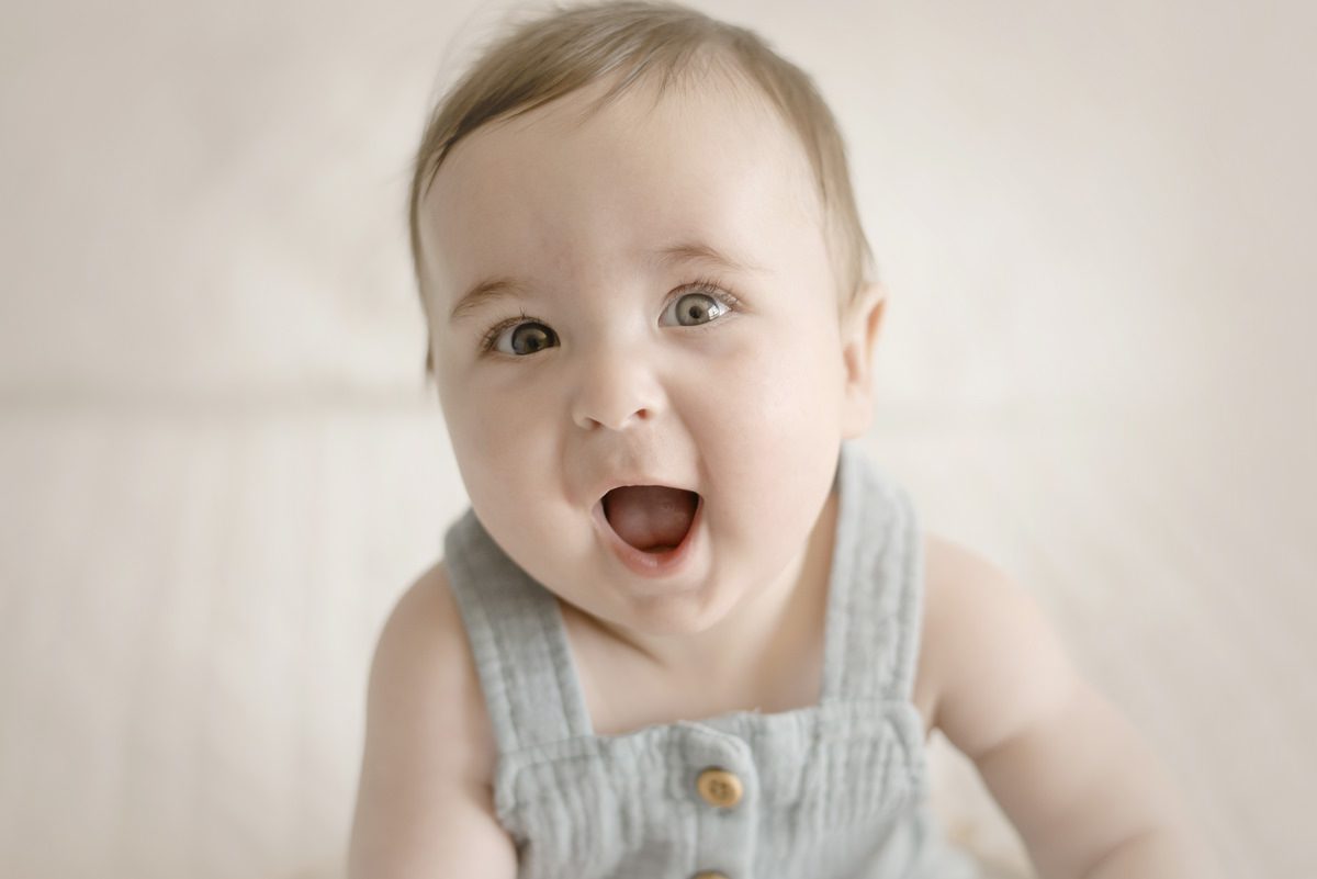 Parker milestones photographer Jamie Herrera; photo of a smiling baby's face