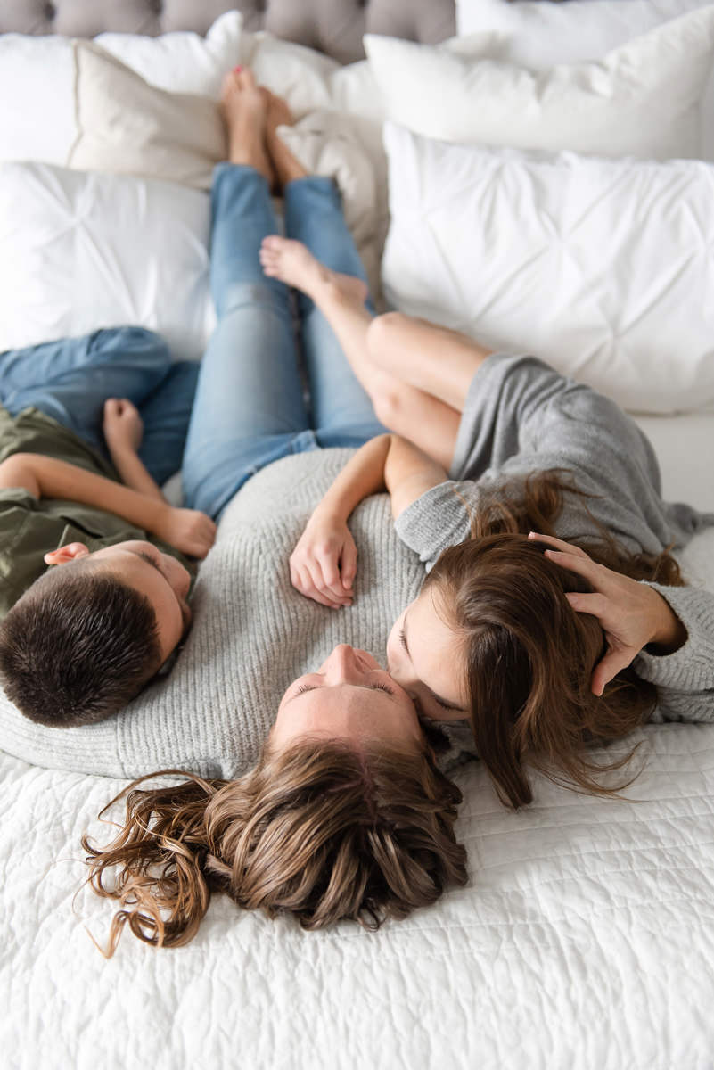 Indoor lifestyle picture of a mom and her kids taken by Jamie Herrera, a Parker family photographer