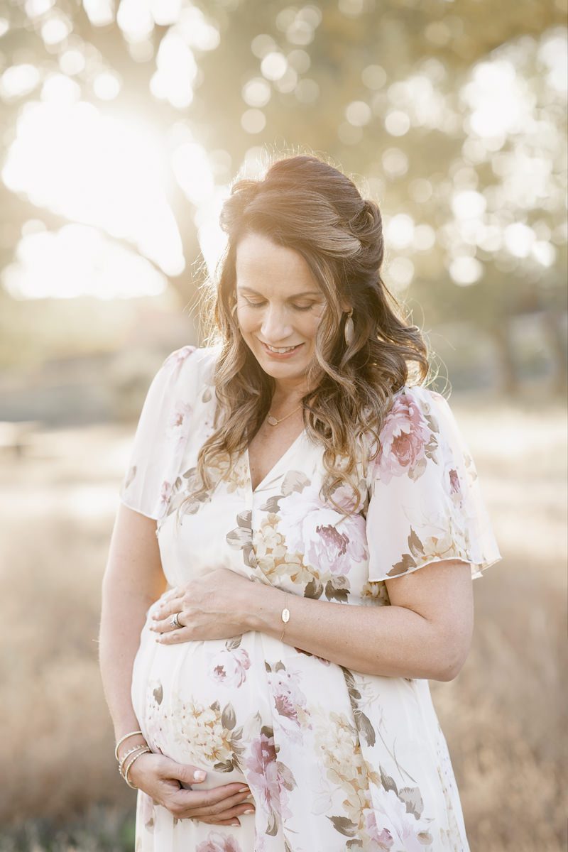 Pregnant mom holding her baby still unborn